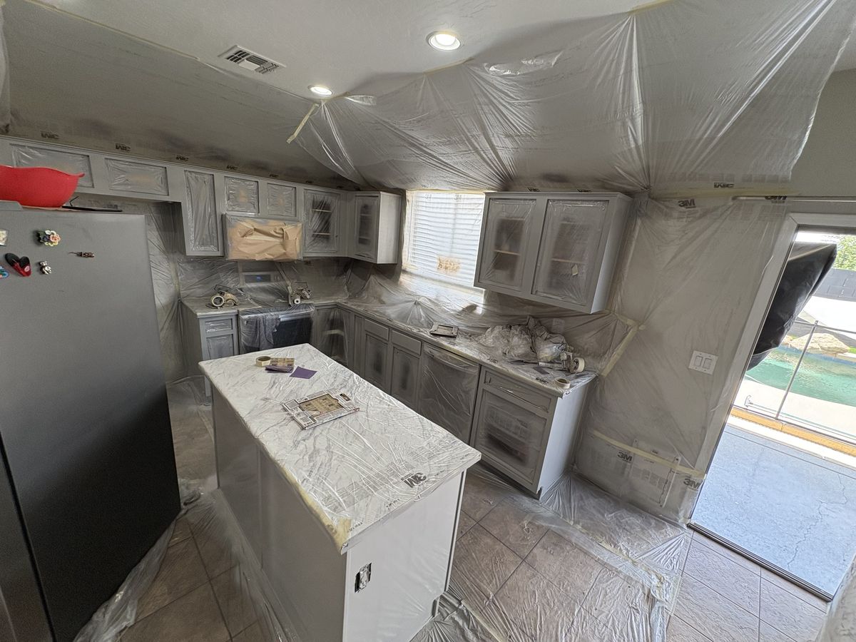Kitchen cabinets and island sprayed — full room masked — Royal Canyon Painting, Maricopa County AZ