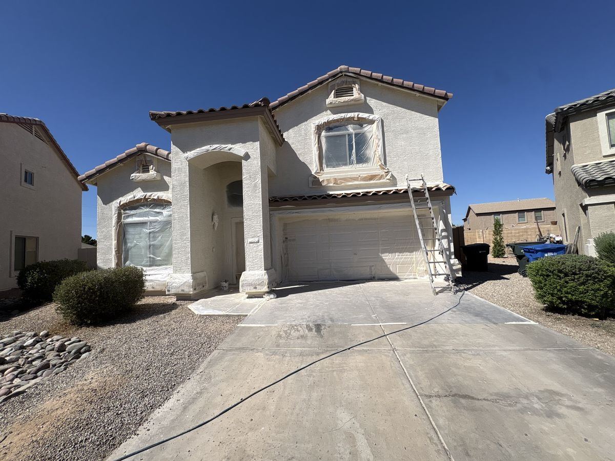 Two-story home taped and covered before the exterior repaint — Royal Canyon Painting, Maricopa County AZ
